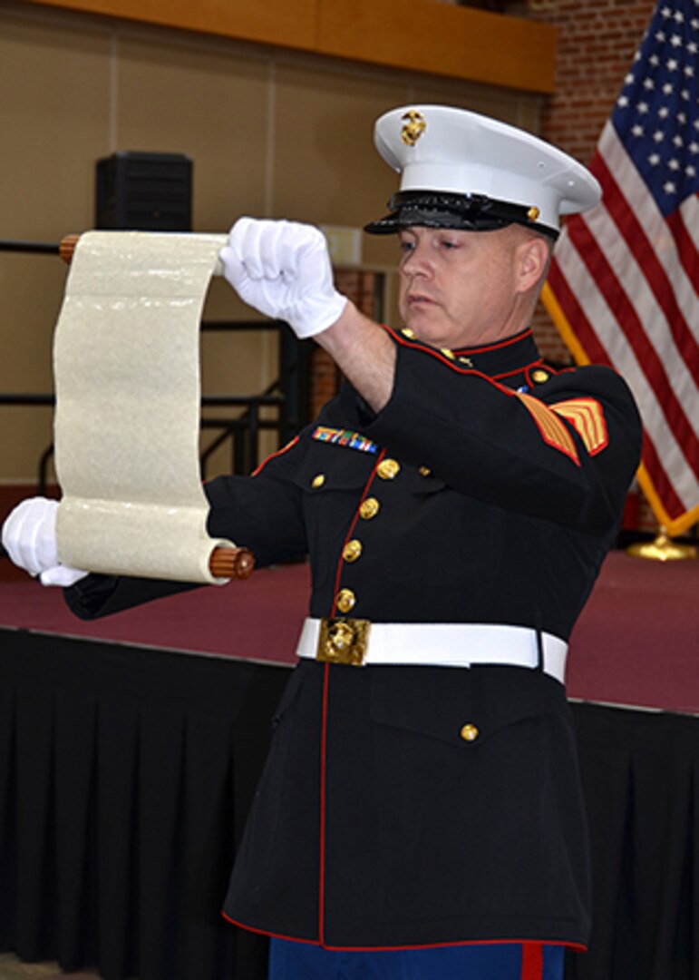 Marine Corps Gunnery Sgt. Sean Mounts reads the 1921 message from the 13th Marine Corps Commandant Lt. Gen. John Lejeune to attendees at the DLA Aviation Marine Corps birthday observation Nov. 10, 2016 at the Lotts Conference Center on Defense Supply Center Richmond, Virginia. 
