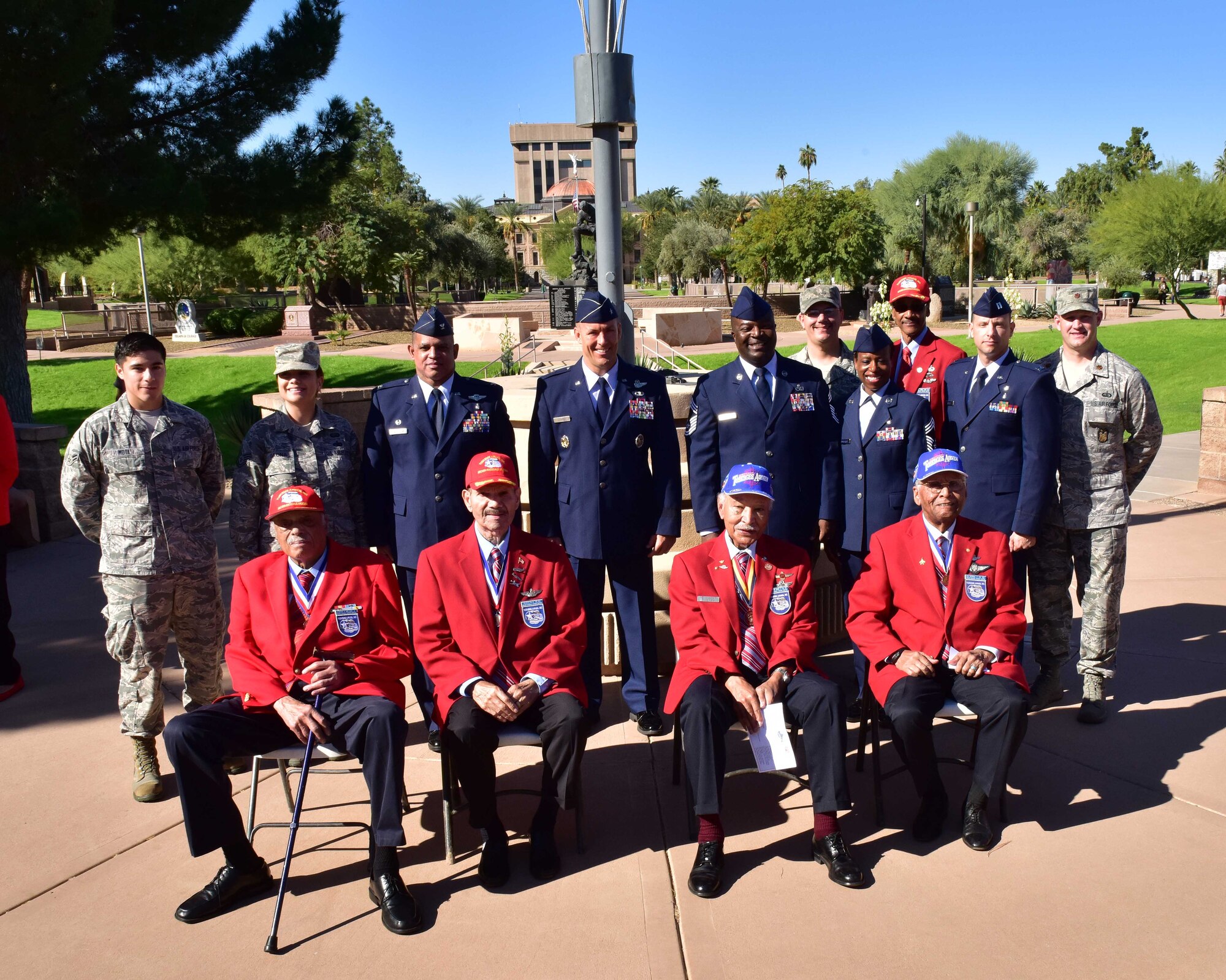 Brig. Gen. Brook Leonard, 56th Fighter Wing commander, stands in a group photo Nov. 11 with four of the original Tuskegee Airmen and 56th and 944th Fighter Wing Airmen stationed at Luke Air Force Base, Ariz. (U.S. Air Force photo by Tech. Sgt. Louis Vega Jr.)