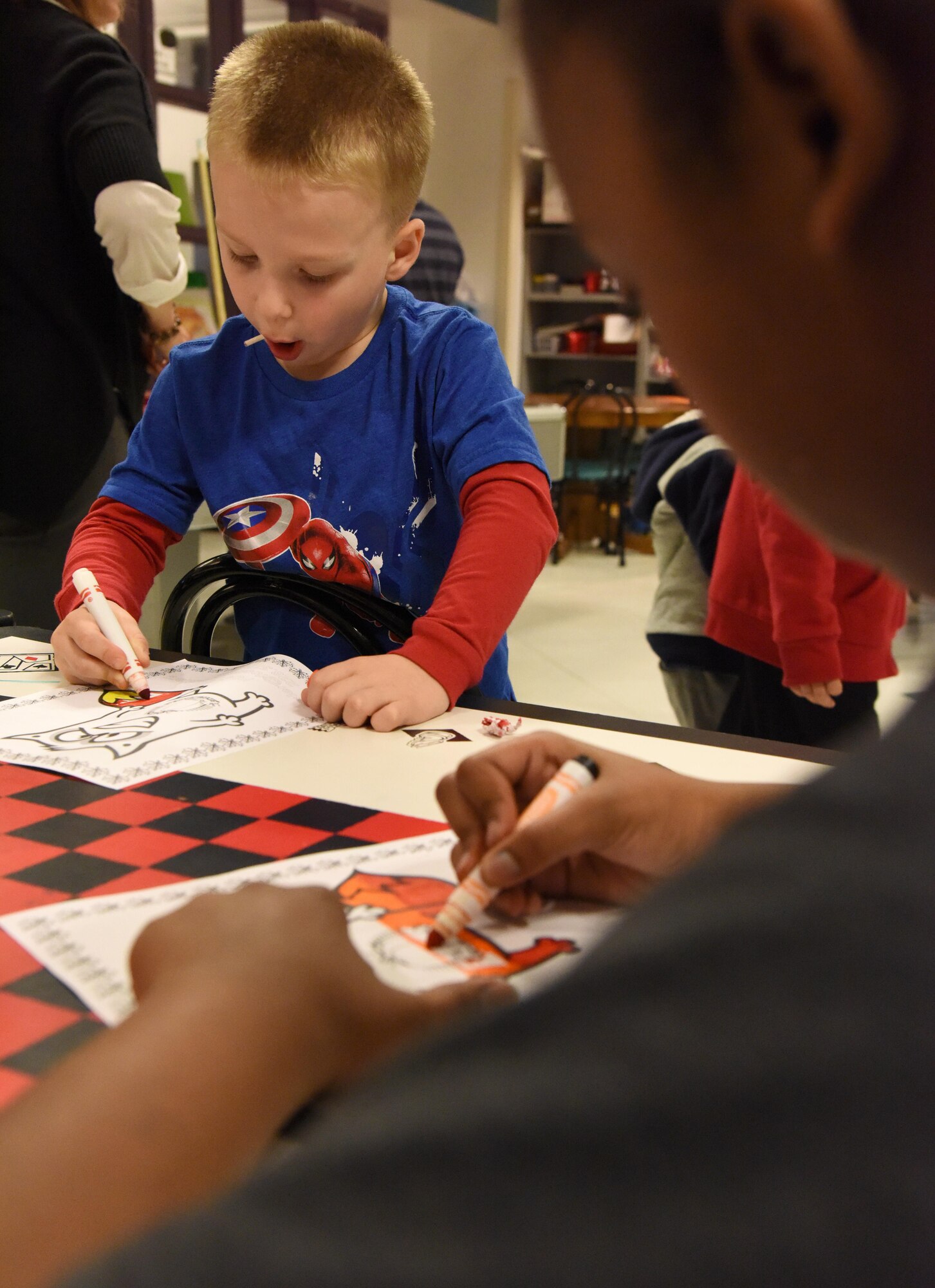 Jackson Sproston, son of Maj. Devin Sproston, 81st Security Forces Squadron commander, participates in a coloring contest during a Town Hall meeting and Children’s Carnival event at the Youth Center Nov. 15, 2016, on Keesler Air Force Base, Miss. The event included a Q-and-A session with base leadership, updates from the Keesler Medical Center, family housing  and 81st Force Support Squadron, as well as dinner and entertainment for children of those who attended. (U.S. Air Force photo by Kemberly Groue/Released)