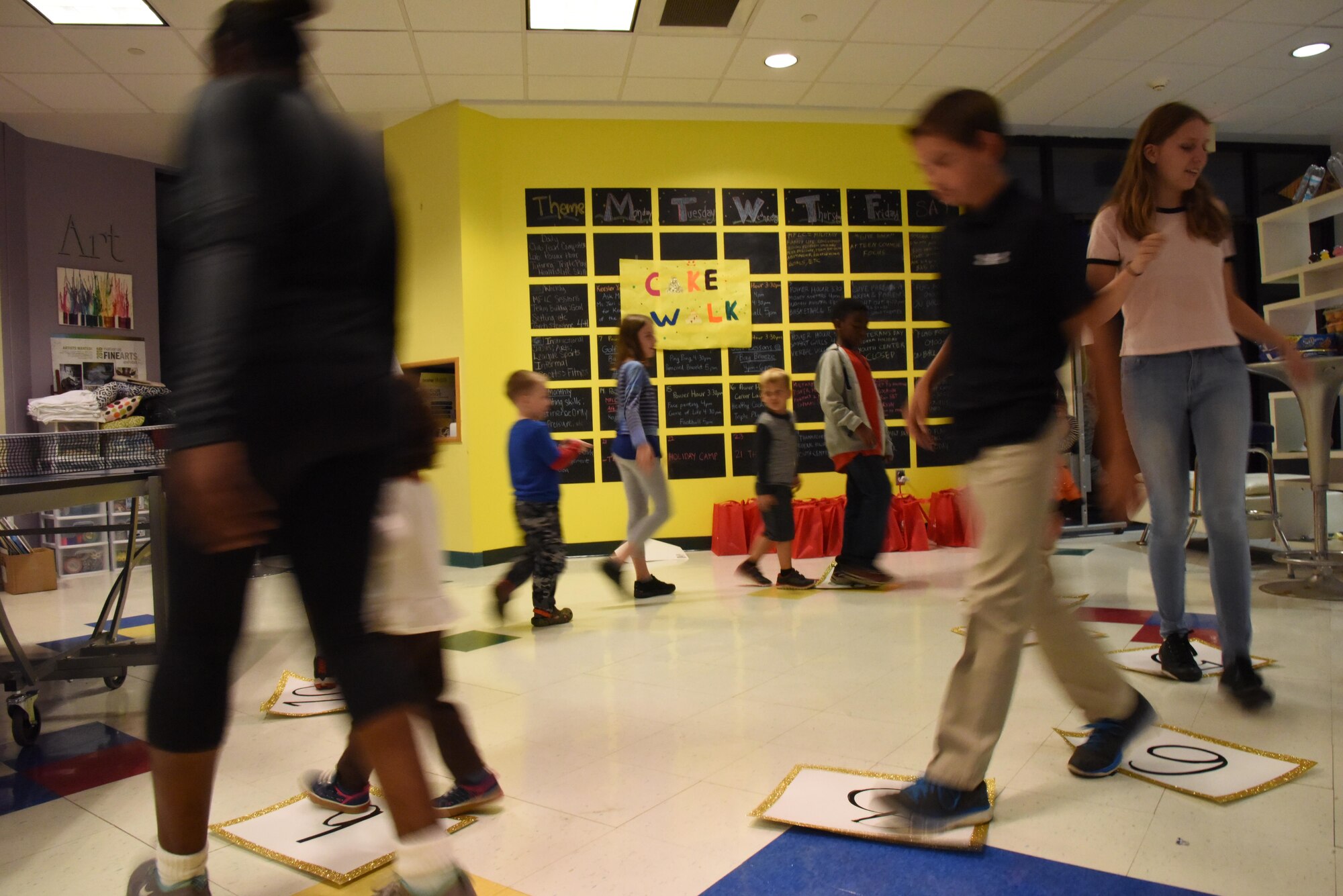 Keesler children participate in a Cake Walk game during a Town Hall meeting and Children’s Carnival event at the Youth Center Nov. 15, 2016, on Keesler Air Force Base, Miss. The event included a Q-and-A session with base leadership, updates from the Keesler Medical Center, family housing and 81st Force Support Squadron, as well as dinner and entertainment for children of those who attended. (U.S. Air Force photo by Kemberly Groue/Released)