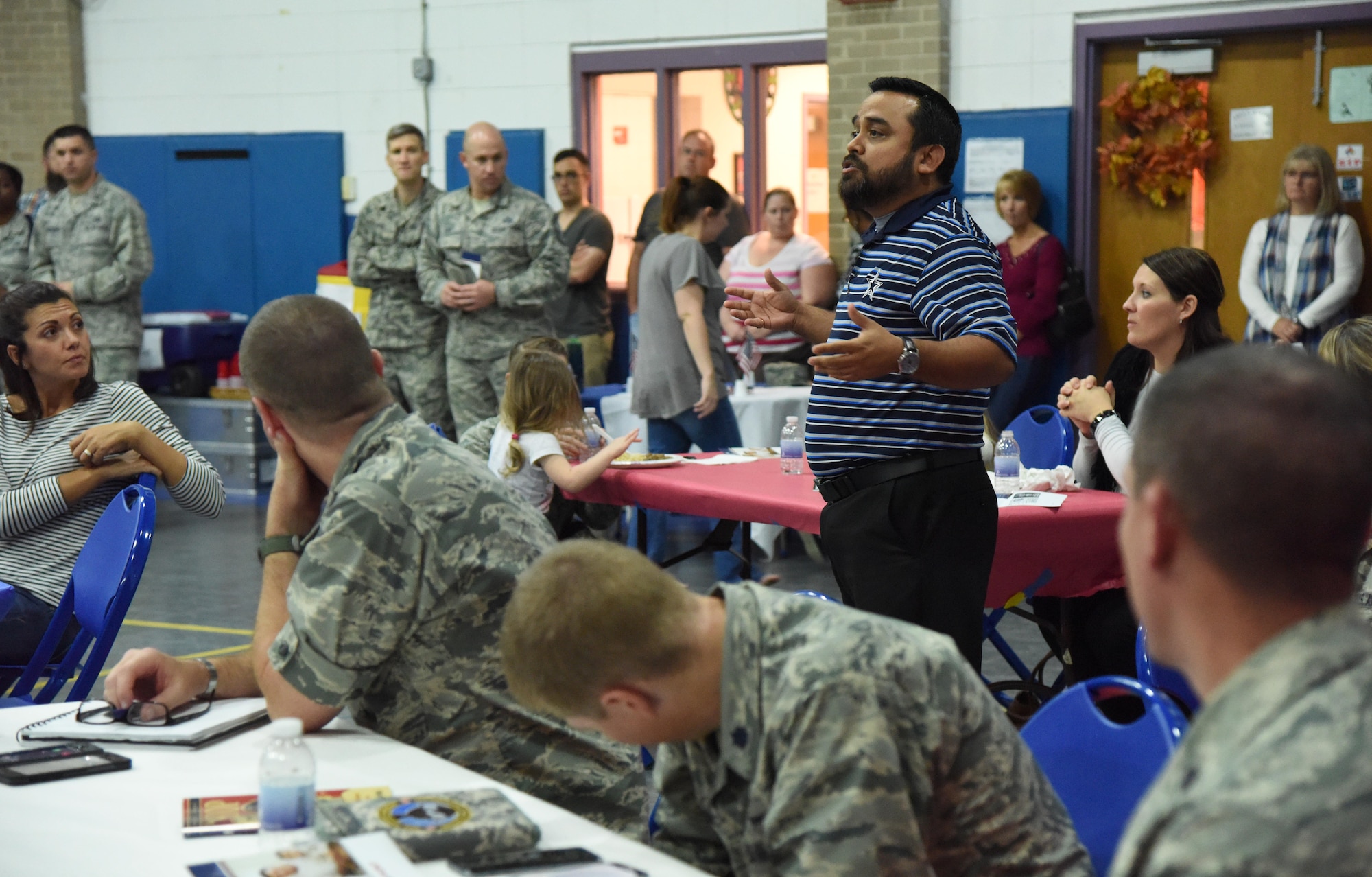 Ruben Cerda, Jr., 81st Force Support Squadron airman and family services flight chief, delivers remarks during a Town Hall meeting and Children’s Carnival event at the Youth Center Nov. 15, 2016, on Keesler Air Force Base, Miss. The event included a Q-and-A session with base leadership, updates from the Keesler Medical Center, family housing and 81st Force Support Squadron, as well as dinner and entertainment for children of those who attended. (U.S. Air Force photo by Kemberly Groue/Released)