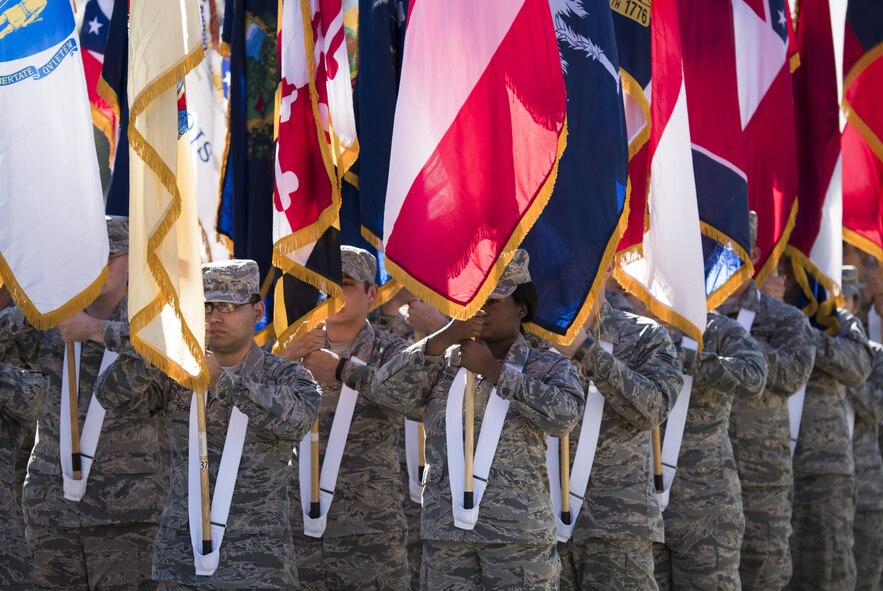 Barksdale Airmen march in the Veterans Parade at the State Fair of Louisiana in Shreveport, Nov. 13, 2016. As part of the parade, 50 Airmen marched down the route, each holding a state flag. (U.S. Air Force photo/Senior Airman Damon Kasberg)