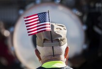 A veteran watches a marching band pass by during the Veterans Parade at the State Fair of Louisiana in Shreveport, Nov. 13, 2016. The parade was held in honor of all those who have served the armed forces, past and present. (U.S. Air Force photo/Senior Airman Damon Kasberg)