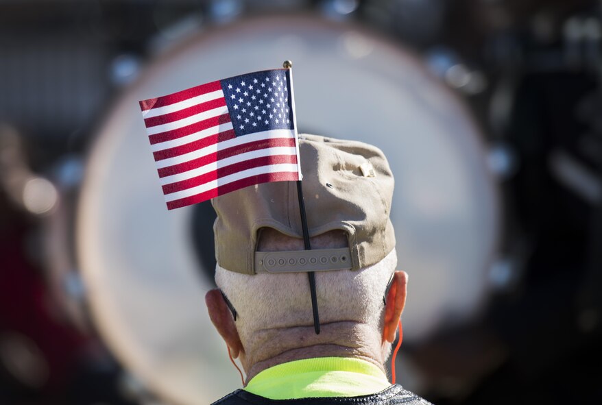 A veteran watches a marching band pass by during the Veterans Parade at the State Fair of Louisiana in Shreveport, Nov. 13, 2016. The parade was held in honor of all those who have served the armed forces, past and present. (U.S. Air Force photo/Senior Airman Damon Kasberg)