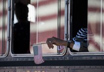 A veteran waves his flag during the Veterans Parade at the State Fair of Louisiana in Shreveport, Nov. 13, 2016. Veterans Day is a federal holiday celebrated Nov. 11, during which Americans honor those who have served in the military. (U.S. Air Force photo/Senior Airman Damon Kasberg)