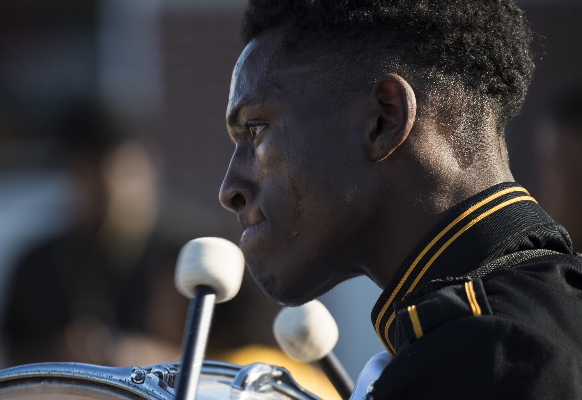 A marching band drummer plays his instrument during the Veterans Parade at the State Fair of Louisiana in Shreveport, Nov. 13, 2016. Hundreds of students took part in the parade to honor veterans. (U.S. Air Force photo/Senior Airman Damon Kasberg)