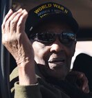 Percy Frazier Sr., a World War II veteran, waves to the crowd during the Veterans Parade at the State Fair of Louisiana in Shreveport, Nov. 13, 2016. The parade was held in honor of all those who have served the armed forces, past and present. (U.S. Air Force photo/Airman 1st Class Stuart Bright)