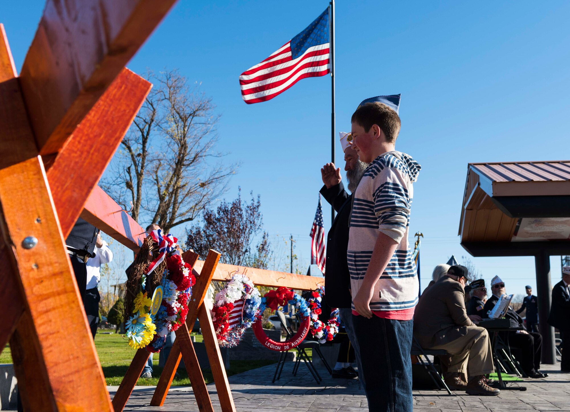 Airmen assigned to the 366th Fighter Wing salute the flag during taps at the annual Veterans day ceremony at Mountain Home, Idaho, Nov. 11, 2016. Taps is a 24-note call played to remember fallen veterans during flag ceremonies, funerals and at dusk. (U.S. Air Force photo by Senior Airman Connor J. Marth/Released)
