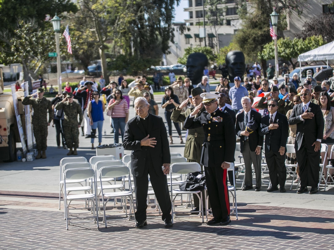 Veterans and members of the local community in Pasadena, California, salute and place their hands over their hearts during the national anthem at a Veteran’s Day and Marine Forces Reserve Centennial celebration, Nov. 11, 2016. The Marine Corps Reserve marked 100 years of service on Aug. 29, 2016. For information on the history and heritage of the Marine Corps Reserve as well as current Marine stories and upcoming Centennial events, please visit www.marines.mil/usmcr100. 