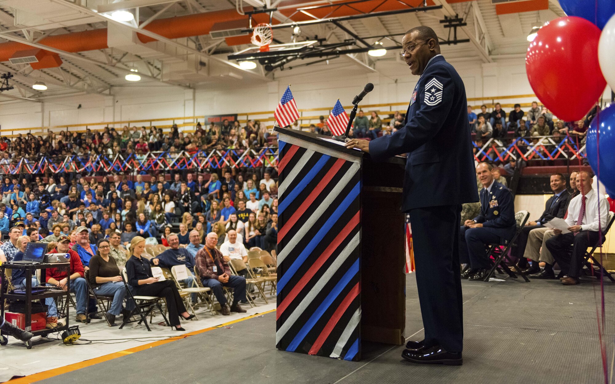 Chief Master Sgt. David Brown, 366th Fighter Wing command chief, speaks to students and staff at Mountain Home High School at Mountain Home, Idaho, Nov. 11, 2016. “We are the land of the free, because we are the home of the brave!” Brown said during his speech. (U.S. Air Force photo by Senior Airman Connor J. Marth/Released)