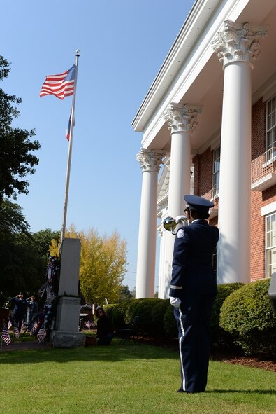 West Lowndes High School Air Force Junior Reserve Officer Training Corps Cadet Destiny Sharrod plays Taps at the 2016 Columbus Veterans Day Wreath-Laying Ceremony Nov. 12, 2016, at the Lowndes County Court House in Columbus, Mississippi. In addition to Taps, attendees observed a moment of silence for veterans past and present. (U.S. Air Force photo by Airman 1st Class John Day)