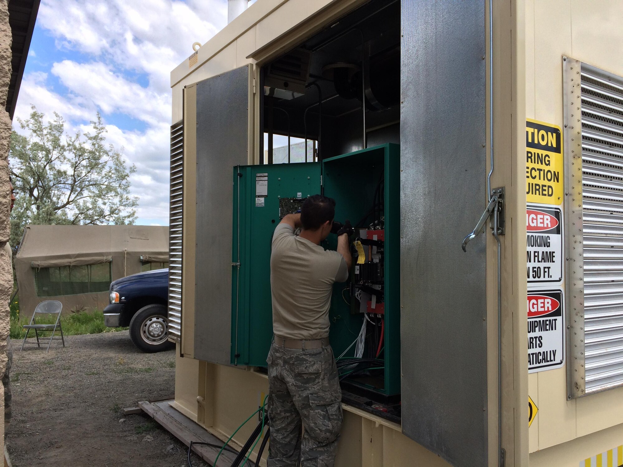 An Airman from the 92nd Civil Engineer Squadron works on an electrical outlet for the pump house July 18, 2016, at Fairchild Air Force Base, Wash. The pumps main purpose are to move wastewater from a lower elevation to a higher one so the system can continue to be gravity fed. Without power to these pumps, the wastewater would collect at a low point, and continue to pool and eventually overflow into the surrounding area. (Courtesy photo)
