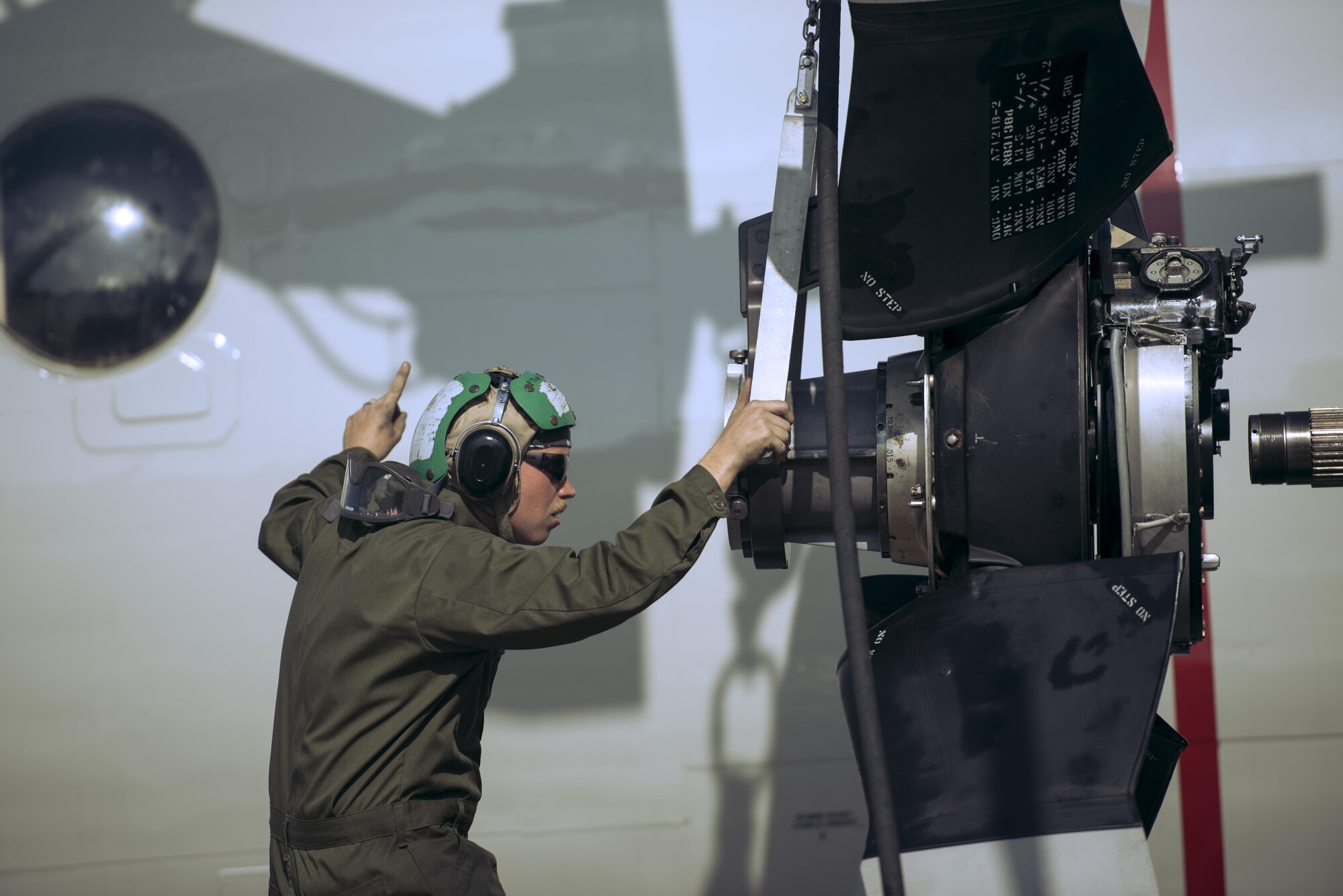 U.S. Navy Petty Officer 3rd Class Brian Mercer, Golden Swordsman Patrol Squadron (VP) 47 aviation mate, works on the P-3 Orion Nov. 8, 2016 while deployed to Kadena Air Base, Japan. The P-3 Orion specializes in intelligence, surveillance, reconnaissance and submarine warfare. (U.S. Air Force photo by Senior Airman Omari Bernard) 