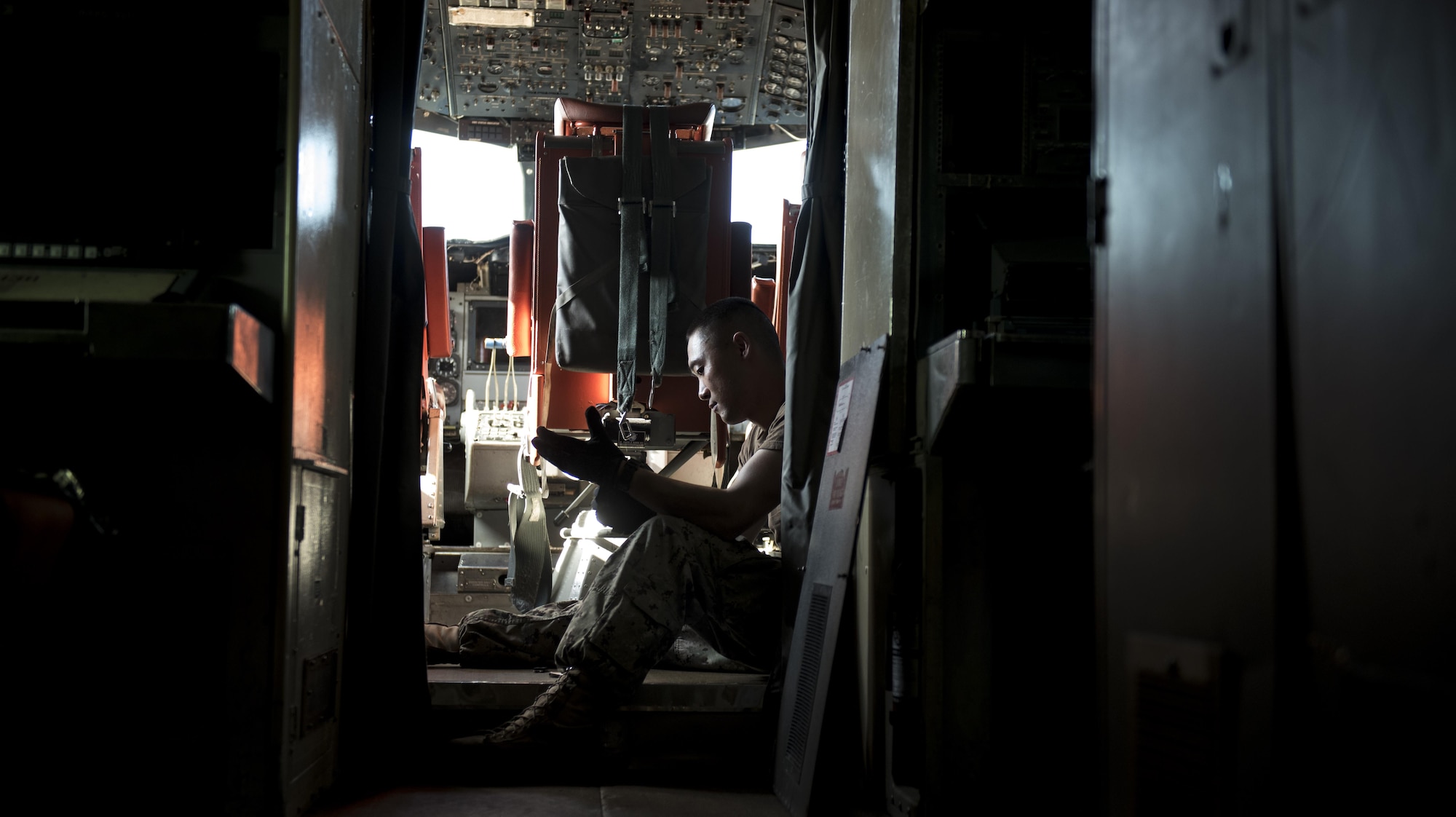 U.S. Navy Seaman Darren Wong, Golden Swordsman Patrol Squadron (VP-47) aviation electrician’s mate, prepares to work on the electrical systems of the P-3 Orion Nov. 8, 2016, at Kadena Air Base, Japan. Kadena Air Base has the capability to host aircraft from the U.S. Air Force’s sister services. (U.S. Air Force photo by Senior Airman Omari Bernard)