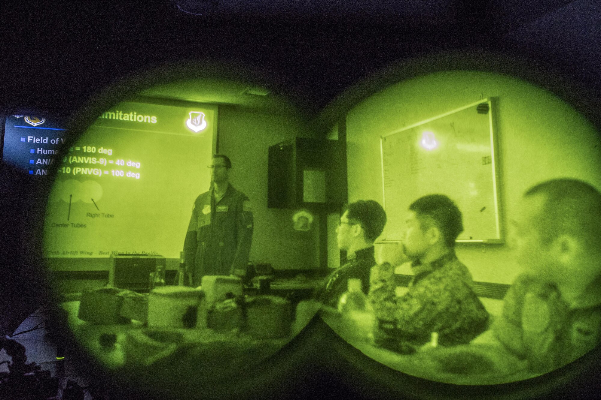 (Left) U.S. Air Force Maj. Douglas Lincoln, 459th Airlift Squadron UH-1N pilot evaluator, briefs night vision goggles capabilities to Japan Air Self-Defense Force crew members with the Komatsu Air Rescue Squadron at Yokota Air Base, Japan, Nov. 9, 2016, during Keen Sword 17. The 459th AS and Komatsu Air RQS Airmen conducted a three-day NVGs and hoist familiarization training. (U.S. Air Force photo by Yasuo Osakabe/Released)  