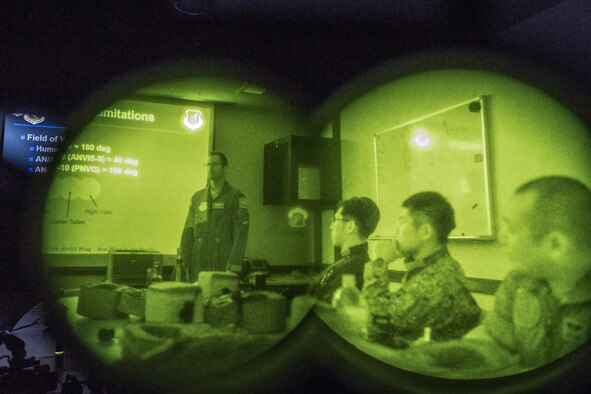 (Left) U.S. Air Force Maj. Douglas Lincoln, 459th Airlift Squadron (AS) UH-1N pilot evaluator, briefs night vision goggle (NVG) capabilities to Japan Air Self-Defense Force crew members with the Komatsu Air Rescue Squadron (RQS) at Yokota Air Base, Japan, Nov. 9, 2016, during Keen Sword (KS) 17. The 459th AS and Komatsu Air RQS Airmen conducted a three-day NVGs and hoist familiarization training.  Japan-U.S. military operations and exercises like KS17 increase readiness to respond to varied crisis situations (U.S. Air Force photo by Yasuo Osakabe/Released)  