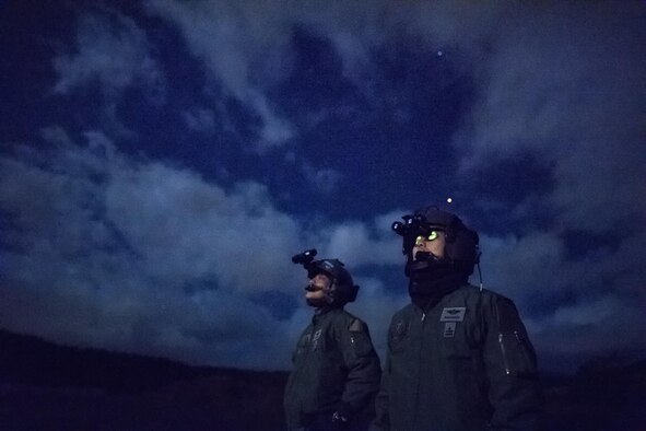 (Right to left) Japan Air Self-Defense Force (JASDF) Maj. Hirotaka Nakamura, Komatsu Air Rescue Squadron (RQS) UH-60J pilot, and JASDF Capt. Daichi Nukimoto, Komatsu Air RQS U125A pilot, perform visual confirmation checks at the Combined Arms Training Center, Camp Fuji, Japan, Nov. 9, 2016, during Keen Sword 17. The exercise is the latest in a series of joint, bilateral field training exercises since 1986 involving U.S. military and Japan Self-Defense Forces personnel designed to increase combat readiness and interoperability of the Japan-U.S. alliance.  (U.S. Air Force photo by Yasuo Osakabe/Released)  