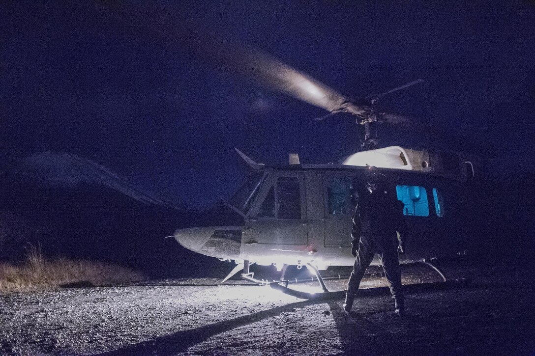 Japan Air Self-Defense Force Capt. Daichi Nukimoto, Komatsu Air Rescue Squadron U125A pilot, prepares to board a U.S. Air Force UH-1N Iroquois after completed a night vision goggles training at Combined Arms Training Center Camp Fuji, Nov. 9, 2016, during the Keen Sword 17. The 459th AS and Komatsu Air RQS Airmen conducted a three-day NVGs and hoist familiarization training. (U.S. Air Force photo by Yasuo Osakabe/Released)  