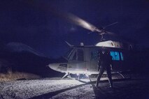 Japan Air Self-Defense Force Capt. Daichi Nukimoto, Komatsu Air Rescue Squadron U125A pilot, prepares to board a U.S. Air Force UH-1N Iroquois after completed a night vision goggles training at Combined Arms Training Center Camp Fuji, Nov. 9, 2016, during the Keen Sword 17. The 459th AS and Komatsu Air RQS Airmen conducted a three-day NVGs and hoist familiarization training. (U.S. Air Force photo by Yasuo Osakabe/Released)  