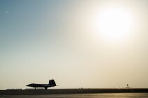 Brig. Gen. Charles Corcoran, 380th Air Expeditionary Wing Commander and F-22 Raptor pilot, taxis across a flight line after successfully completing 1000 flight hours in the F-22 at an undisclosed location in Southwest Asia, Nov. 11, 2016. F-22’s have conducted more than 700 sorties in support Operation Inherent Resolve. (U.S. Air Force photo by Senior Airman Tyler Woodward)