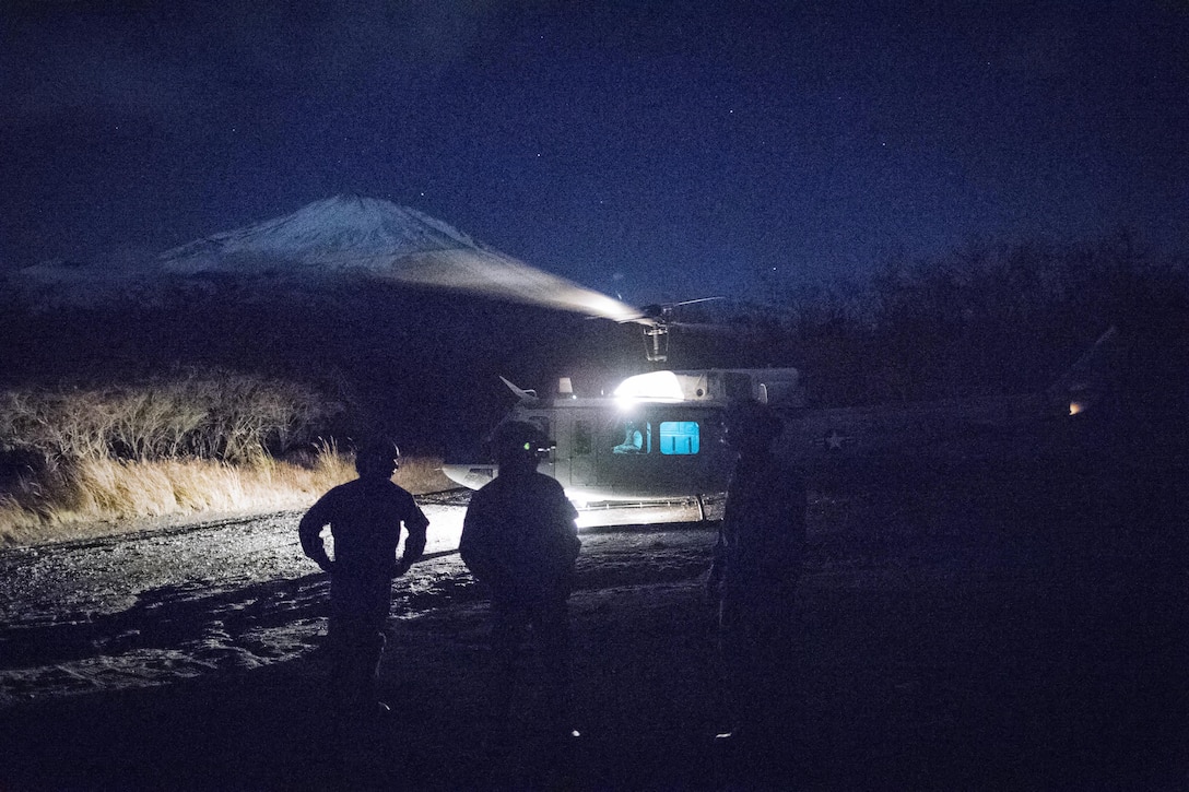 Airmen with the 459th Airlift Squadron and Japan Air Self-Defense Force Komatsu Air Rescue Squadron conduct a night vision goggles training at Combined Arms Training Center Camp Fuji, Nov. 9, 2016, during the Keen Sword 17.  The 459th AS and Komatsu Air RQS Airmen conducted a three-day NVGs and hoist familiarization training. (U.S. Air Force photo by Yasuo Osakabe/Released)  