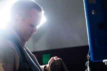 Brig. Gen. Charles Corcoran, 380th Air Expeditionary Wing Commander and F-22 Raptor fighter pilot prepares his flight suit equipment before flying a mission in support of Operation Inherent Resolve at an undisclosed location in Southwest Asia, Nov. 11, 2016. F-22s and other Coalition aircraft have created insurmountably complex problems for Da’esh – specifically by preparing the battlespace for Coalition ground forces – during the liberation of Mosul, Iraq.  (U.S. Air Force photo by Senior Airman Tyler Woodward)