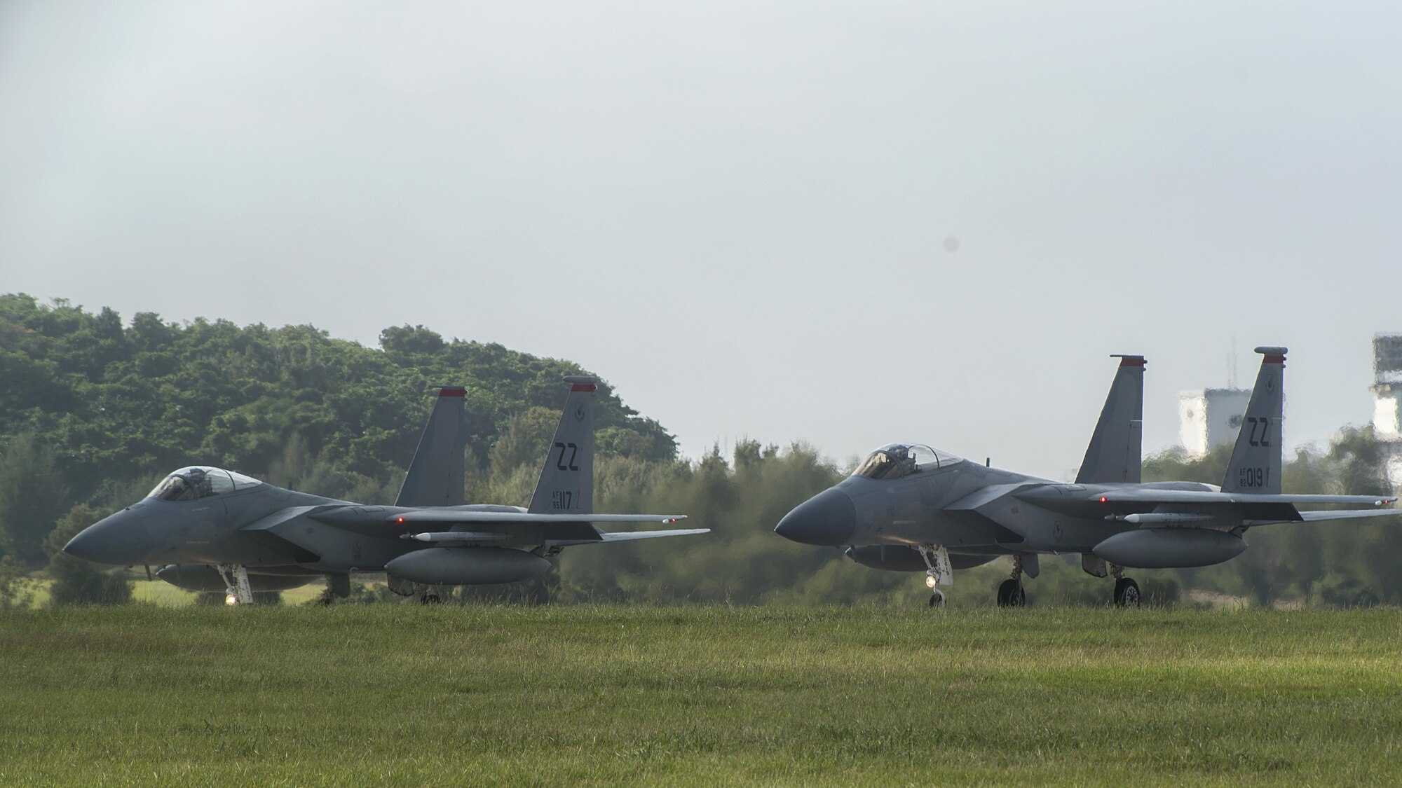 U.S. Air Force F-15 Eagles from the 67th Fighter Squadron pause before taking off on the runway Nov. 16, 2016, at Kadena Air Base, Japan. The Eagle’s air superiority is achieved through a mixture of unprecedented maneuverability and acceleration, range, weapons and avionics. (U.S. Air Force photo by Airman 1st Class Corey M. Pettis/Released)