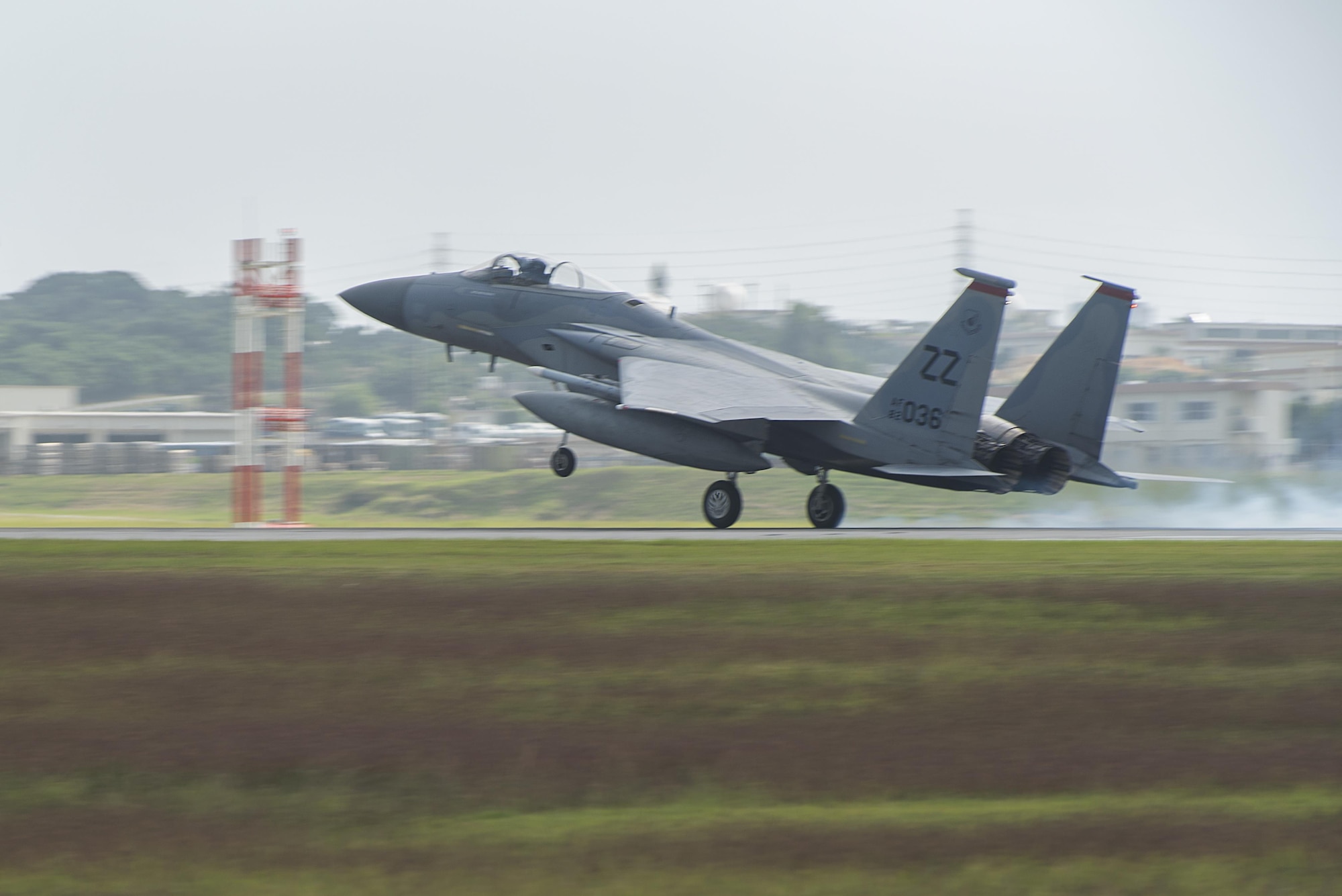 A U.S. Air Force F-15 Eagle from the 67th Fighter Squadron lands on the runway Nov. 16, 2016, at Kadena Air Base, Japan. The F-15’s superior maneuverability and acceleration are achieved through high engine thrust-to-weight ratio and low wing loading. (U.S. Air Force photo by Airman 1st Class Corey M. Pettis/Released)