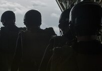 Japan Air Self-Defense Force pararescuemen prepare to jump out of an MC-130J Commando II during Exercise Keen Sword 17 Nov. 10, 2016, off the coast of Okinawa, Japan. During Keen Sword, pararescuemen respond to scenarios such as a downed aircraft simulation over the Pacific Ocean. (U.S. Air Force photo by Senior Airman Lynette M. Rolen/Released) 