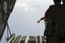 U.S. Air Force pararescuemen from the 31st Rescue Squadron jump out of an MC-130J Commando II during Exercise Keen Sword 17 Nov. 10, 2016, off the coast of Okinawa, Japan. Exercises like Keen Sword demonstrate the ability of rescue teams to quickly gather resources and respond to a situation. (U.S. Air Force photo by Senior Airman Lynette M. Rolen/Released)
