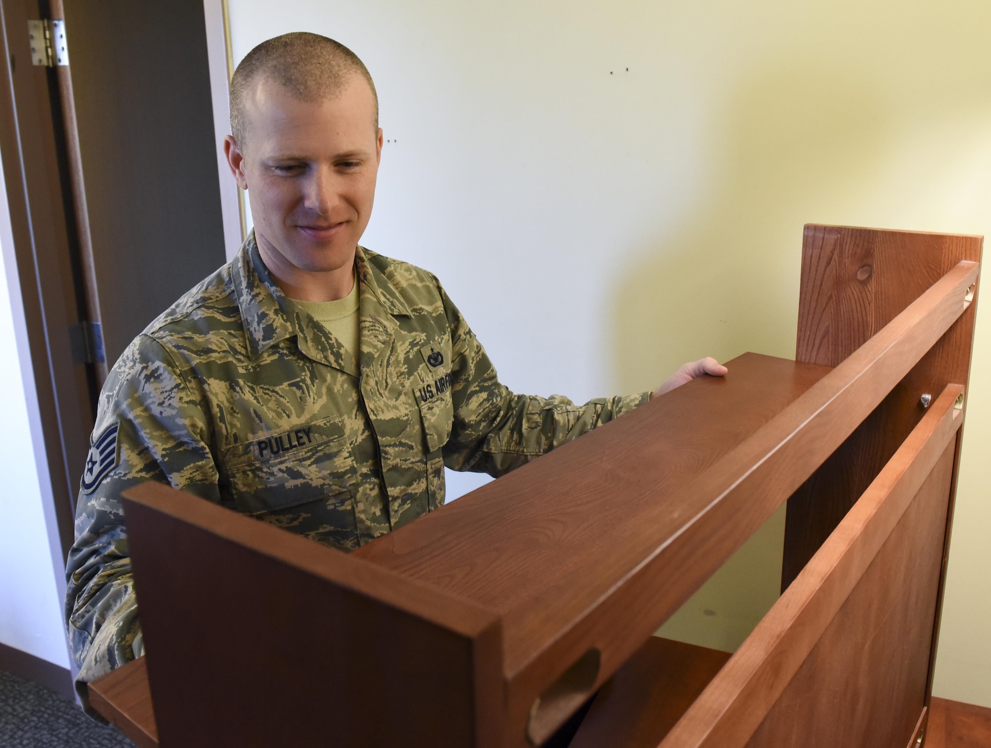 Staff Sgt. James Pulley, 8th Civil Engineering Squadron airmen dormitory leader, repairs a shelf inside the dorms at Kunsan Air Base, Republic of Korea, Nov. 15, 2016. ADLs are responsible for the management of dorm logistics and the wellbeing of occupants who reside in them. (U.S. Air Force photo by Senior Airman Michael Hunsaker/Released)