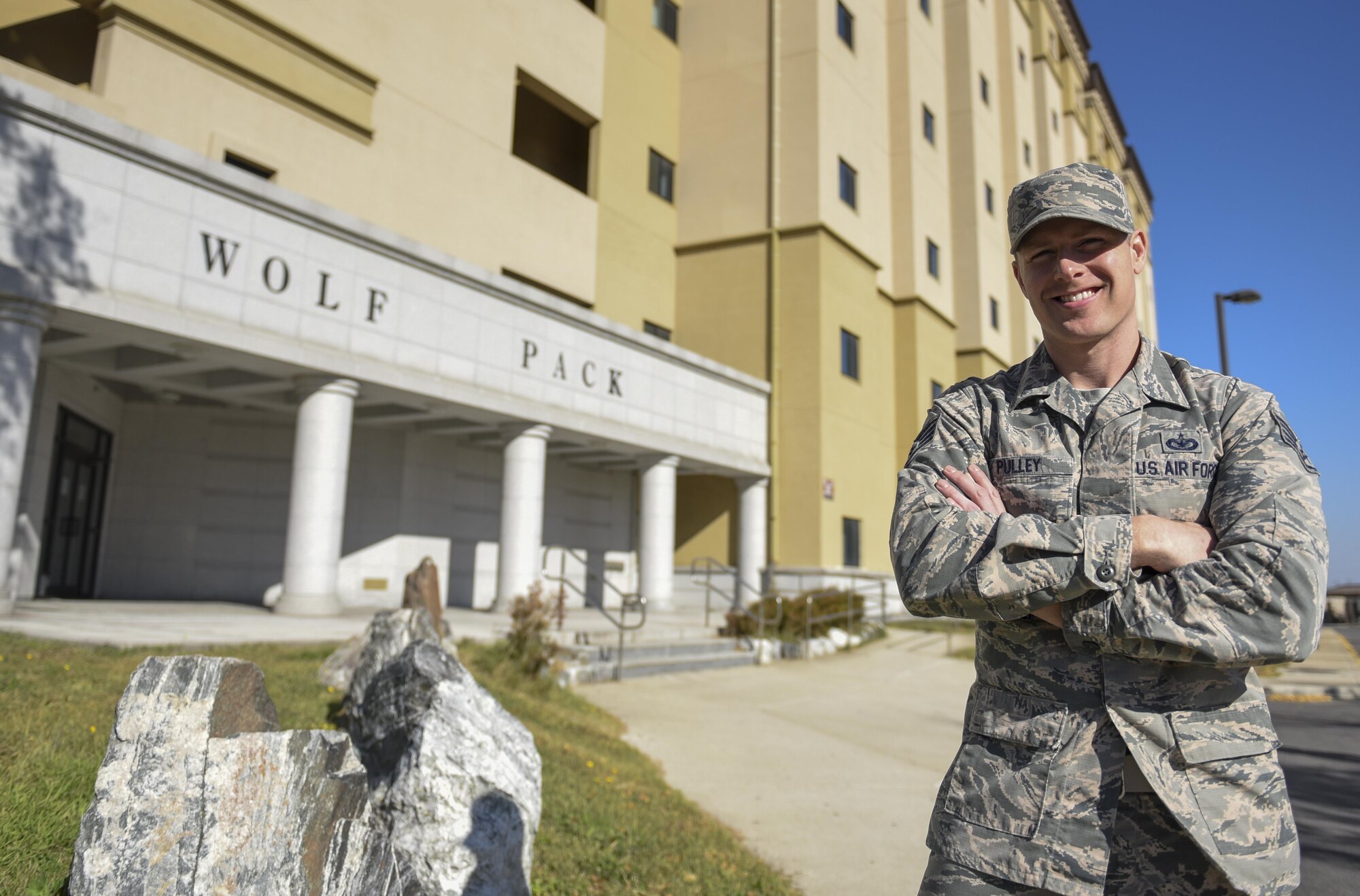 Staff Sgt. James Pulley, 8th Civil Engineering Squadron airmen dormitory leaders, stands outside the dorm he manages at Kunsan Air Base, Republic of Korea, Nov. 15, 2016. ADLs are responsible for the management of dorm logistics and the wellbeing of occupants who reside in them. (U.S. Air Force photo by Senior Airman Michael Hunsaker/Released)