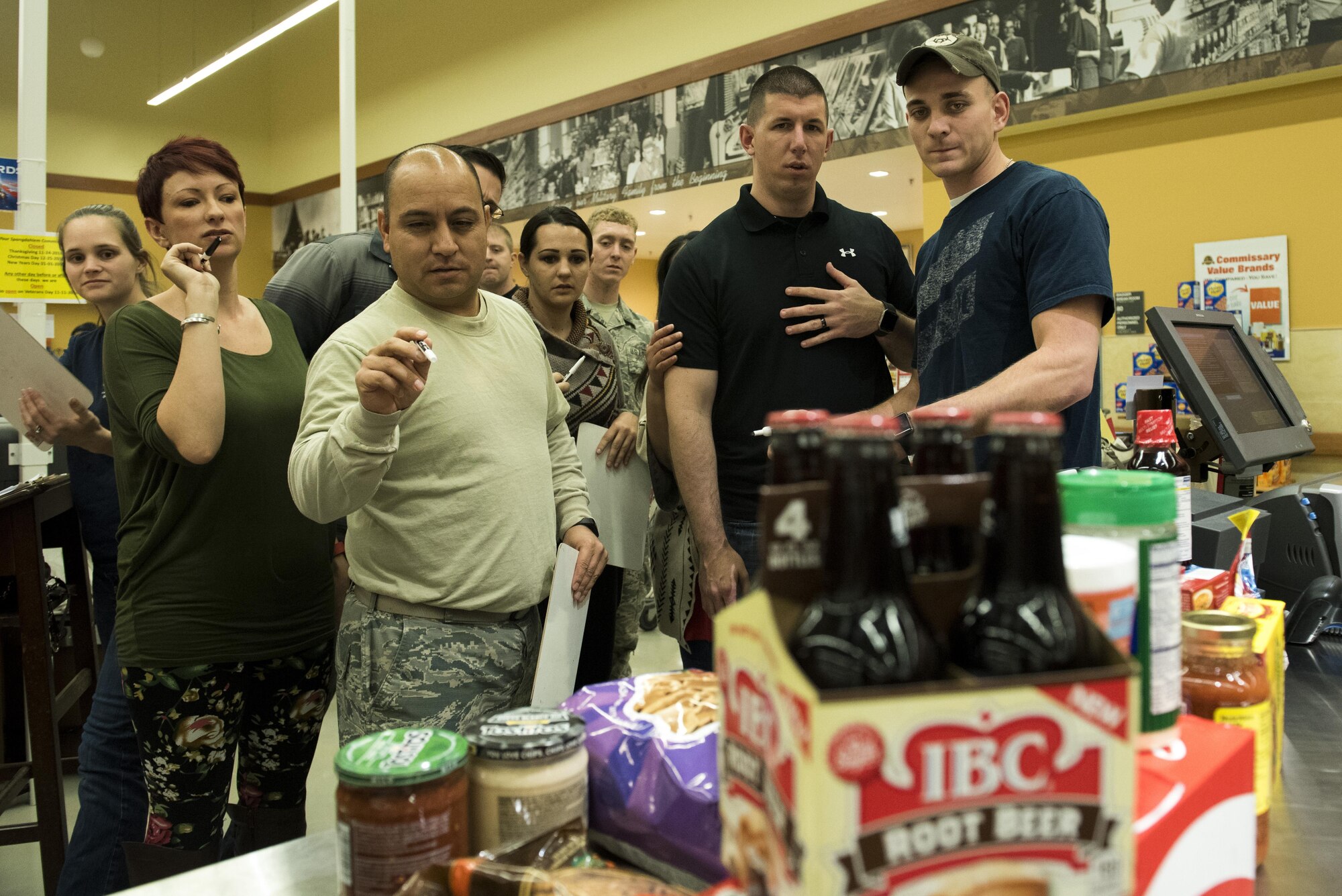 Members of Spangdahlem estimate the total price of various food items during the Spangdahlem Spouses and Enlisted Members Club Commissary Sweep at Spangdahlem Air Base, Germany, Nov. 15, 2016. Along with price estimation, participants answered riddles to compete for free groceries and commissary gift cards. (U.S. Air Force photo by Airman 1st Class Preston Cherry)