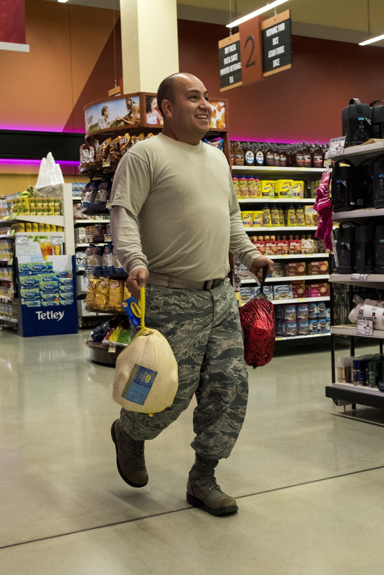 U.S. Air Force Staff Sgt. David Gomez, 52nd Force Support Squadron training manager, races down an aisle during the Spangdahlem Spouses and Enlisted Members Club Commissary Sweep at Spangdahlem Air Base, Germany, Nov. 15, 2016. The event gave participants the opportunity to receive free groceries and Commissary gift cards ranging from $50 to $200. (U.S. Air Force photo by Airman 1st Class Preston Cherry)