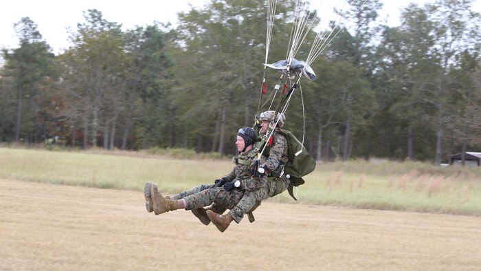 Marines with 2nd Reconnaissance Battalion land in a drop zone during a Tandem Offset Resupply Delivery System Course at Skydive Paraclete XP in Raeford, N.C., Nov. 1, 2016. This training teaches Marines how to jump with personnel or equipment in order to expand their mission capabilities. 