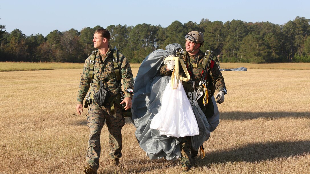 Marines from 2nd Reconnaissance Battalion regroup after a jump during a Tandem Offset Resupply Delivery Course in Raeford, N.C., Nov. 2, 2016. The unit conducted this training to certify their Marines to jump with personnel and equipment. 