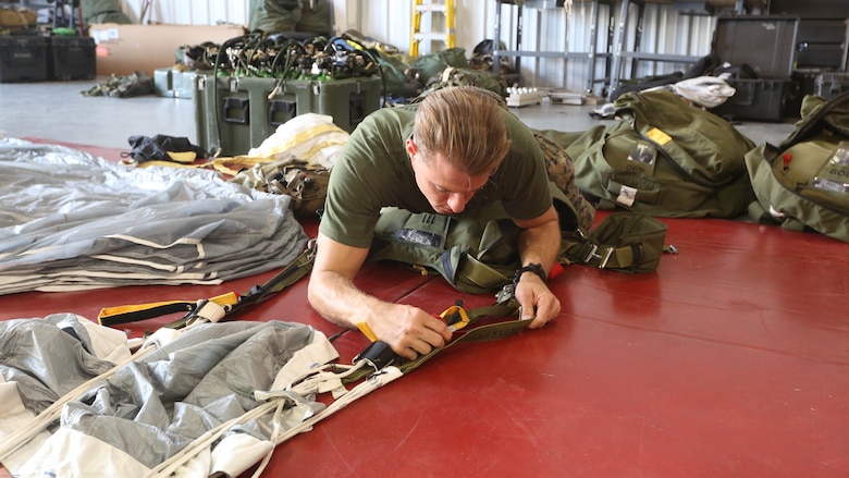 Sgt. Thomas P. Mooney prepares his parachute for a freefall jump at Skydive Paraclete XP in Raeford, N.C., Nov. 3, 2016. Mooney and his fellow Marines conducted freefall jumps as part of a Tandem Offset Resupply Delivery System Course. Mooney is a military freefall team leader from 2nd Reconnaissance Battalion at Camp Lejeune, N.C. 