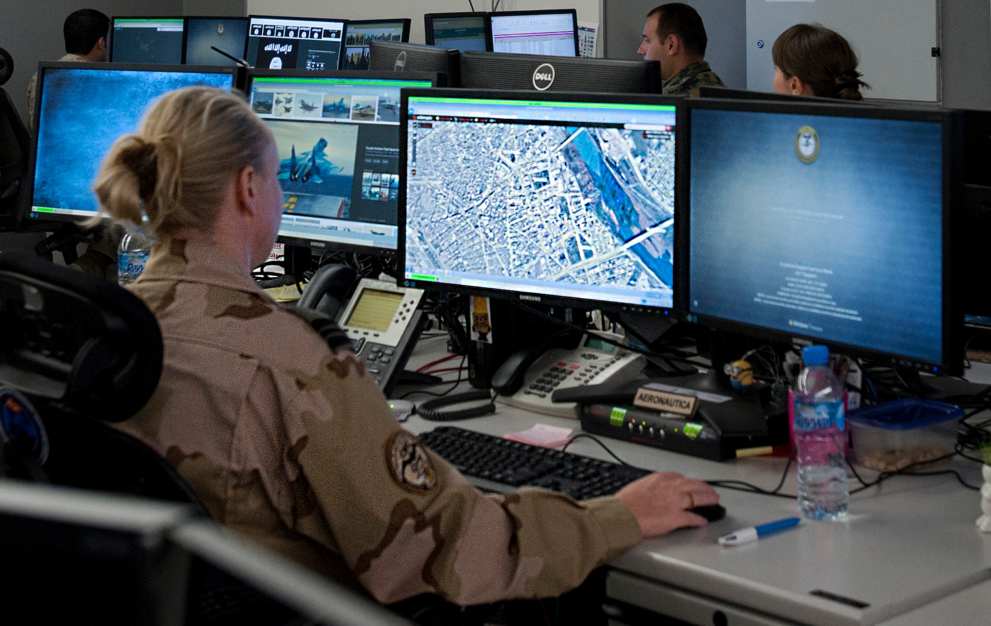 A U.S. Coalition Intelligence Fusion Cell member reviews a map at the Combined Air and Space Operations Center Nov. 16, 2016, at Al Udeid Air Base, Qatar. The CIFC is a diverse multinational team that plans, coordinates, develops and disseminates timely, relevant and accurate information among international partners and divisions within the CAOC. (U.S. Air Force photo by Staff Sgt. R. Alex Durbin)