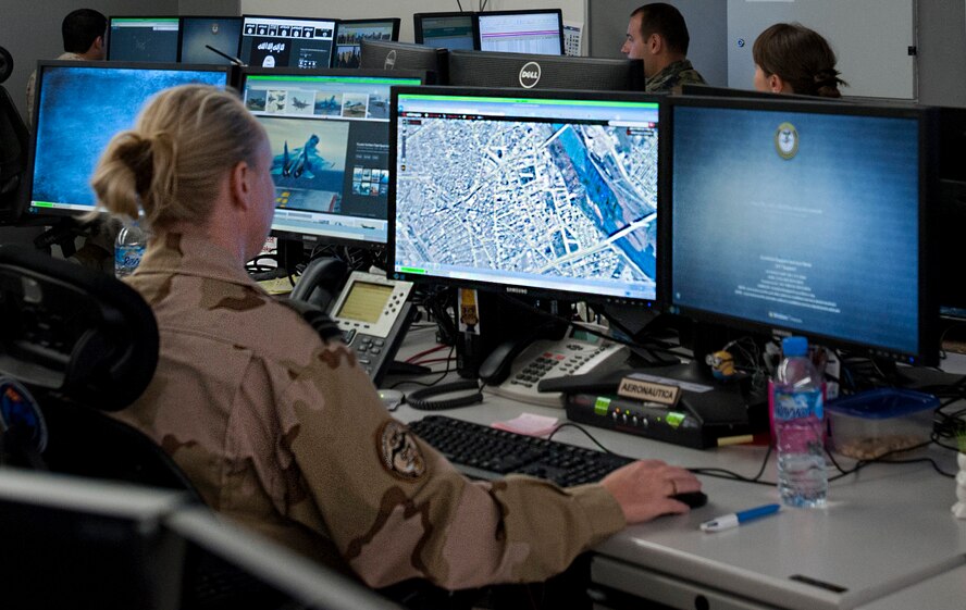 A U.S. Coalition Intelligence Fusion Cell member reviews a map at the Combined Air and Space Operations Center Nov. 16, 2016, at Al Udeid Air Base, Qatar. The CIFC is a diverse multinational team that plans, coordinates, develops and disseminates timely, relevant and accurate information among international partners and divisions within the CAOC. (U.S. Air Force photo/Staff Sgt. R. Alex Durbin)