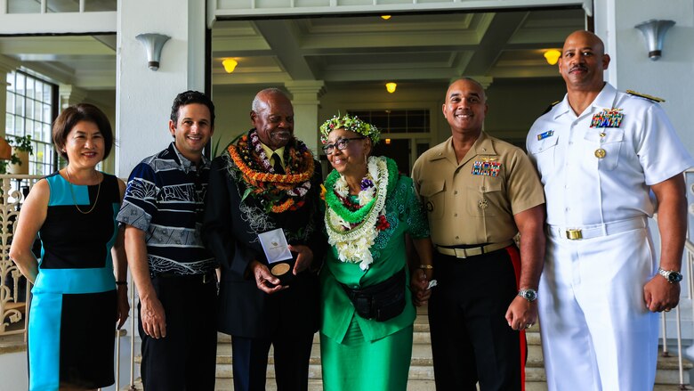 Distinguished guests stand with Dr. Ernest James Harris, Jr. during his Congressional Gold Medal ceremony in Honolulu Nov. 12, 2016. Harris was awarded his Congressional Gold Medal for his service as a Montford Point Marine. 