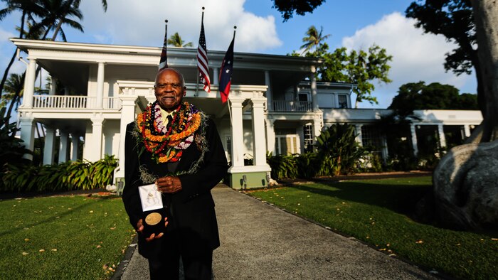 Dr. Ernest James Harris, Jr. stands with his Congressional Gold Medal after a ceremony in Honolulu Nov. 12, 2016. Harris was awarded his Congressional Gold Medal for his service as a Montford Point Marine. 