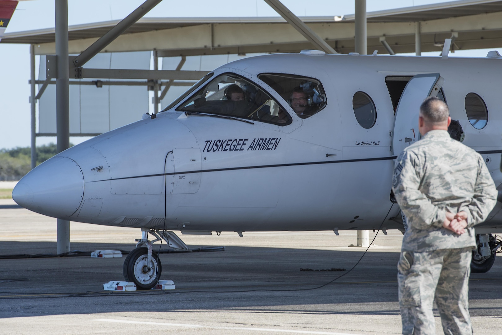 Secretary of Defense Ash Carter prepares to take an orientation flight in a T-1A Jayhawk as Chief Master Sgt. Brian Kentta, 12th Flying Training Wing command chief, looks on at Joint Base San Antonio-Randolph Nov. 16, 2016. Carter made visits to all three JBSA locations to ensure future readiness of service members. (U.S. Air Force photo by Airman 1st Class Lauren Ely)