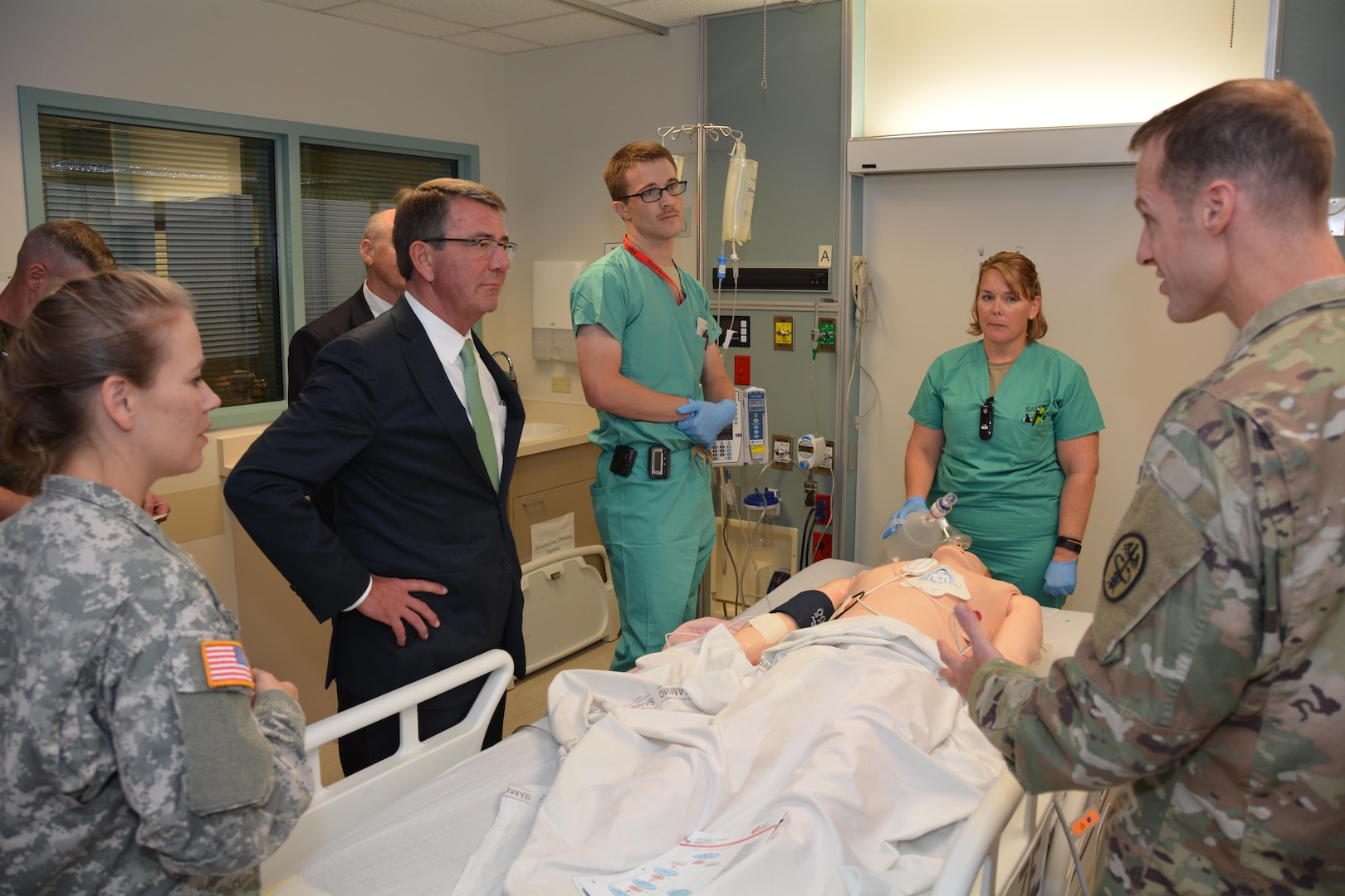 Secretary of Defense Ash Carter and U.S. Army Lt. Col. Matthew Borgman discuss wireless transmission of CPR using a mannequin simulator during his November 16 visit to Brooke Army Medical Center, Fort Sam Houston, Texas. BAMC is the Army’s largest and busiest medical center. Secretary Carter personally thanked wounded and ill warriors, their families and BAMC staff for their service and sacrifice. Secretary Carter toured labs and simulation centers pioneering new advances in diagnostic imaging and new medical training aids. His visit at BAMC was part of a tour of Joint Base San Antonio, with stops at JBSA-Lackland and JBSA-Randolph. (U.S. Army photo by Robert Shields/Released)