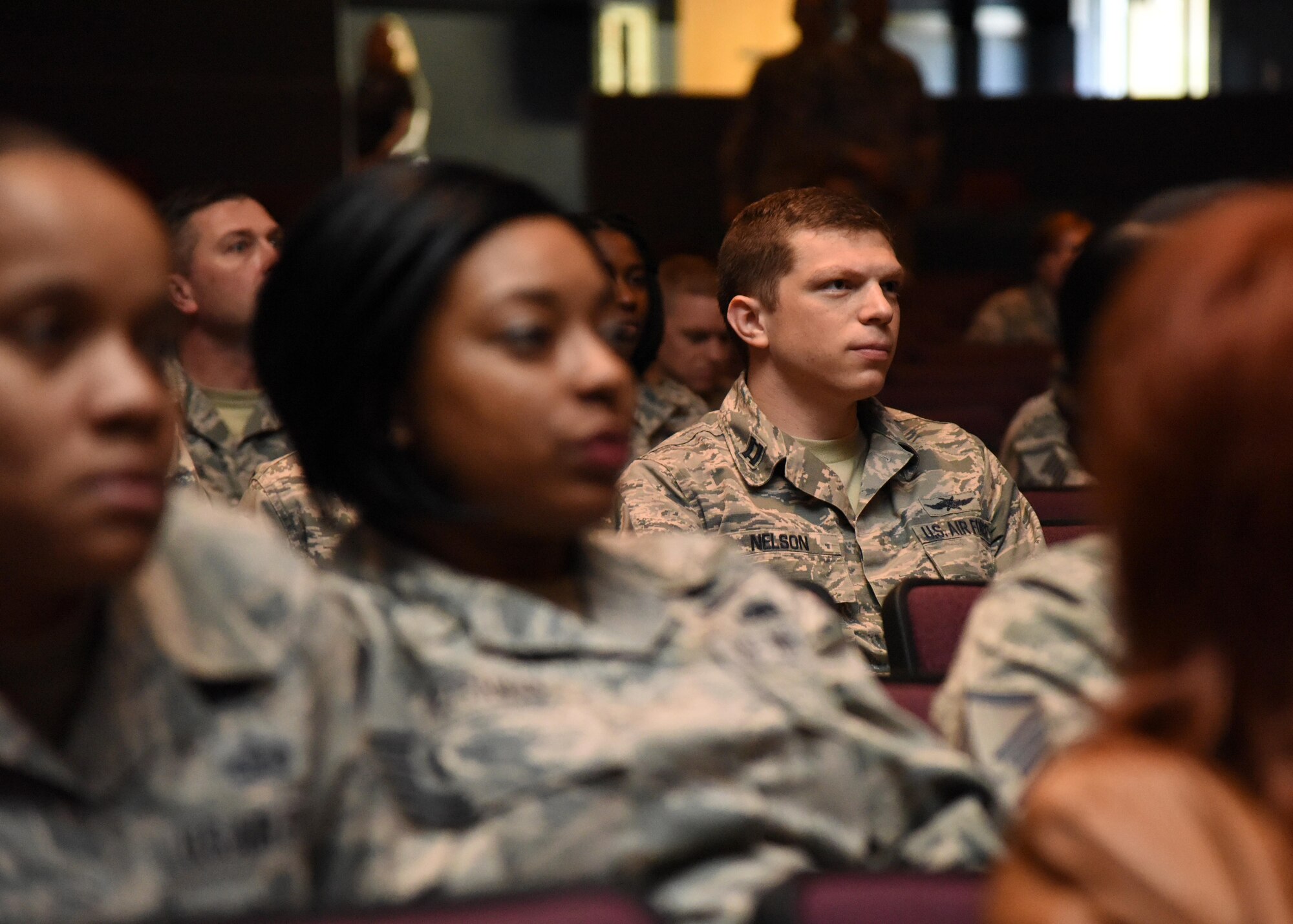 Capt. Alexander Nelson, 81st Communications Squadron operations flight commander, attends a Storytellers event at the Welch Theater Nov. 16, 2016, on Keesler Air Force Base, Miss. The event, consisting of three speakers who shared their stories about resiliency, was one of several events held throughout Dragon Week, which focuses on resiliency and teambuilding initiatives across the base. (U.S. Air Force photo by Kemberly Groue/Released)