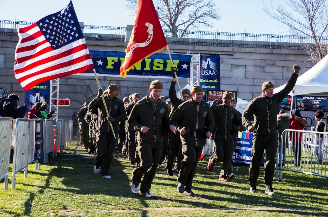 Brigadier General Paul K. Lebidine (center), commanding general of 4th Marine Division, leads the Marines of 1st Battalion, 25th Marine Regiment, through the finish line of the Disabled American Veterans 5K run at Fort Independence on Castle Island in Boston, Nov. 12, 2016. From World War I through the wars in Iraq and Afghanistan, the Marine Corps Reserve has played an essential role in the Marine Corps Total Force by augmenting and reinforcing the Active Component across the full range of military operations. Reserve Marines bring unique skills and advanced degrees from their civilian occupations into their service with the Marine Corps. (U.S. Marine Corps photo by Cpl. Melissa Martens/ Released) 