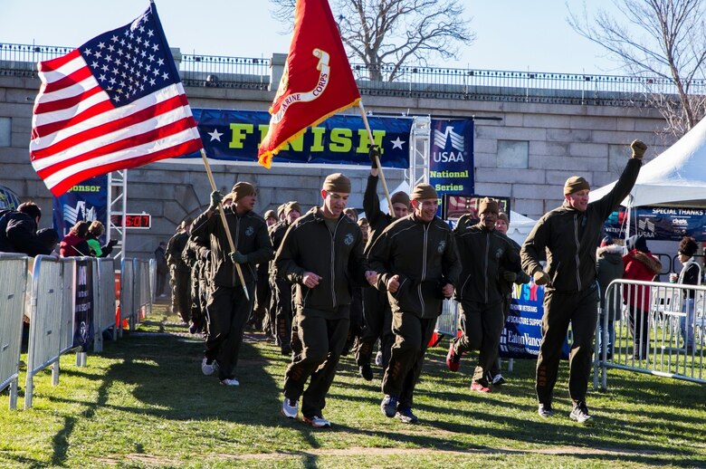 Brigadier General Paul K. Lebidine (center), commanding general of 4th Marine Division, leads the Marines of 1st Battalion, 25th Marine Regiment, through the finish line of the Disabled American Veterans 5K run at Fort Independence on Castle Island in Boston, Nov. 12, 2016. From World War I through the wars in Iraq and Afghanistan, the Marine Corps Reserve has played an essential role in the Marine Corps Total Force by augmenting and reinforcing the Active Component across the full range of military operations. Reserve Marines bring unique skills and advanced degrees from their civilian occupations into their service with the Marine Corps. (U.S. Marine Corps photo by Cpl. Melissa Martens/ Released) 