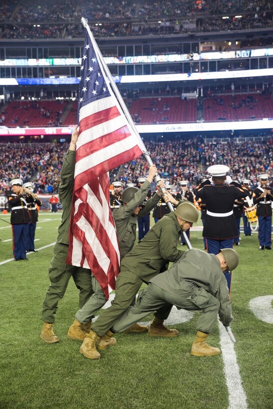 Marines from Marine Corps Band New Orleans reenact the Iwo Jima flag raising during the band’s half-time performance at the New England Patriots game against the Seattle Seahawks at Gillette Stadium. Nov 13, 2016.  The band performed a Centennial concert to commemorate the 100th anniversary of the Marine Corps Reserve. From World War I through the wars in Iraq and Afghanistan, the Marine Corps Reserve has played an essential role in the Marine Corps Total Force by augmenting and reinforcing the active component across the full range of military operations. (U.S. Marine Corps photo by Cpl. Melissa Martens/ Released) 