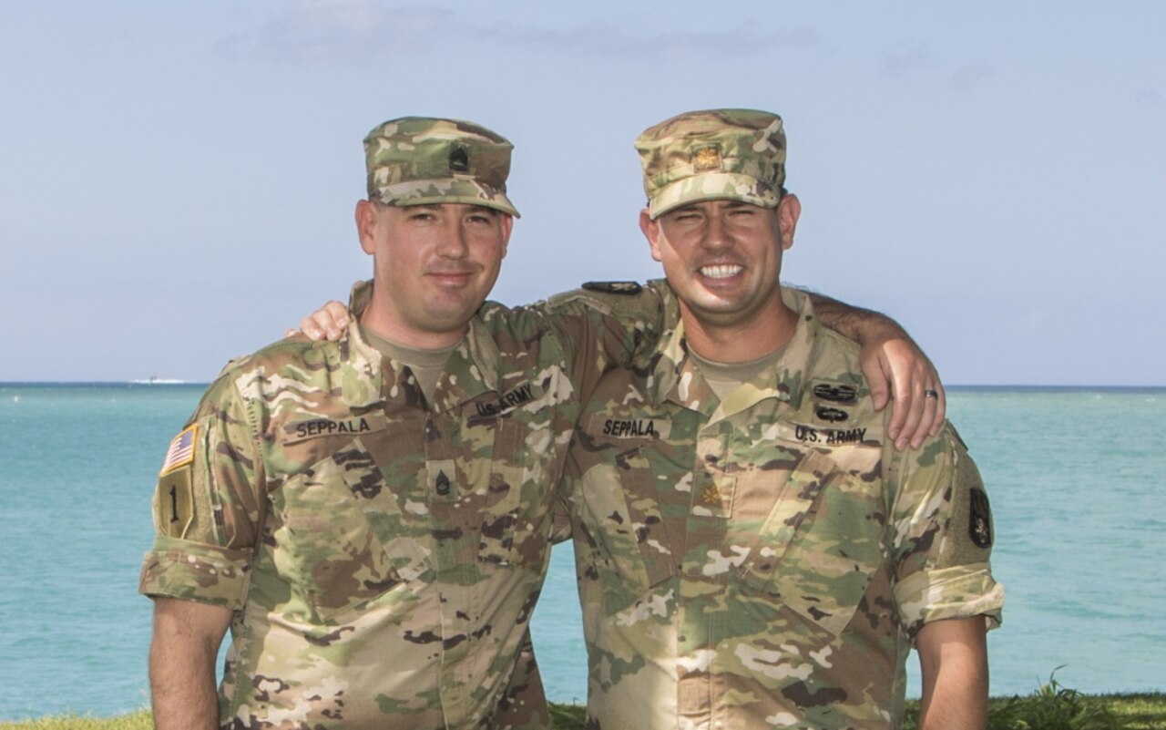 Army Maj. Joel Seppala, right, a future operations planner, and Army Sgt. 1st Class Timothy Seppala, the senior religious affairs noncommissioned officer-in-charge with the 94th Army Air and Missile Defense Command, pose together for a photo at Joint Base Pearl Harbor-Hickam, Hawaii, July 26, 2016. The two brothers are enjoying their assignment together in Hawaii. Army photo by Sgt. Kimberly K. Menzies