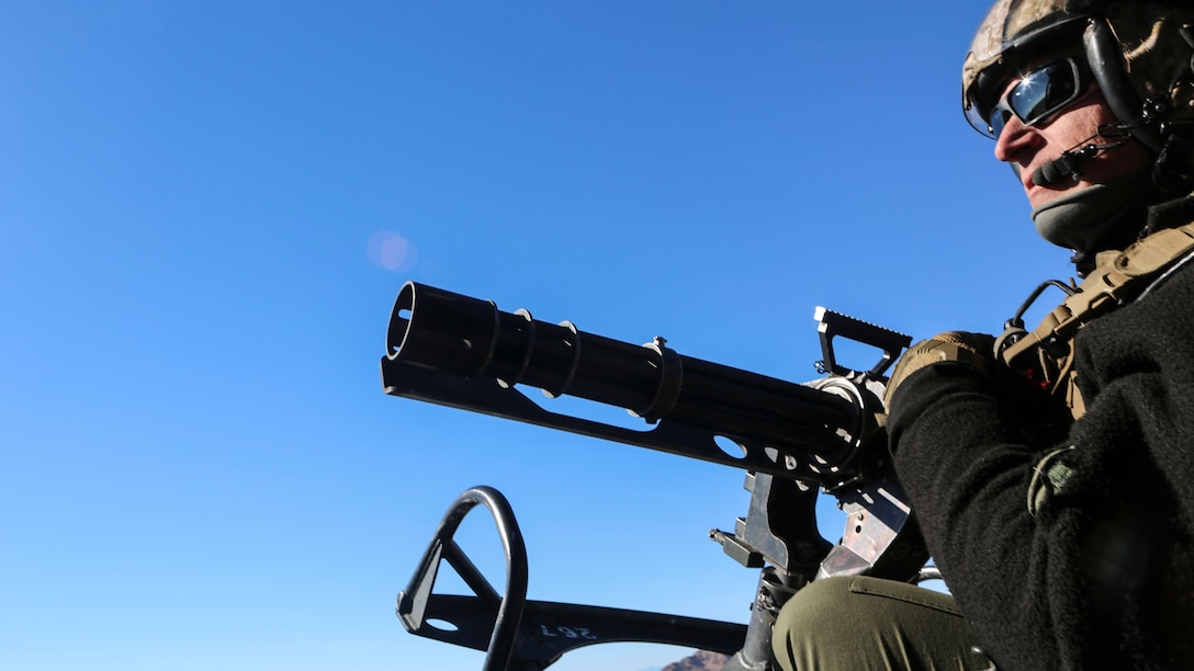 Gunnery Sgt. Christopher Slaven, a crew chief with Marine Light Attack Helicopter Squadron (HMLA) 267 mans the M134 Minigun on the UH-1Y Huey while waiting to engage simulated targets during exercise Scorpion Fire 1-16 near Navy Air Facility El Centro, Calif. Jan. 25. HMLA-267 supported the exercise with close air support with live-fire capabilities, Jan. 25 to Feb. 5.