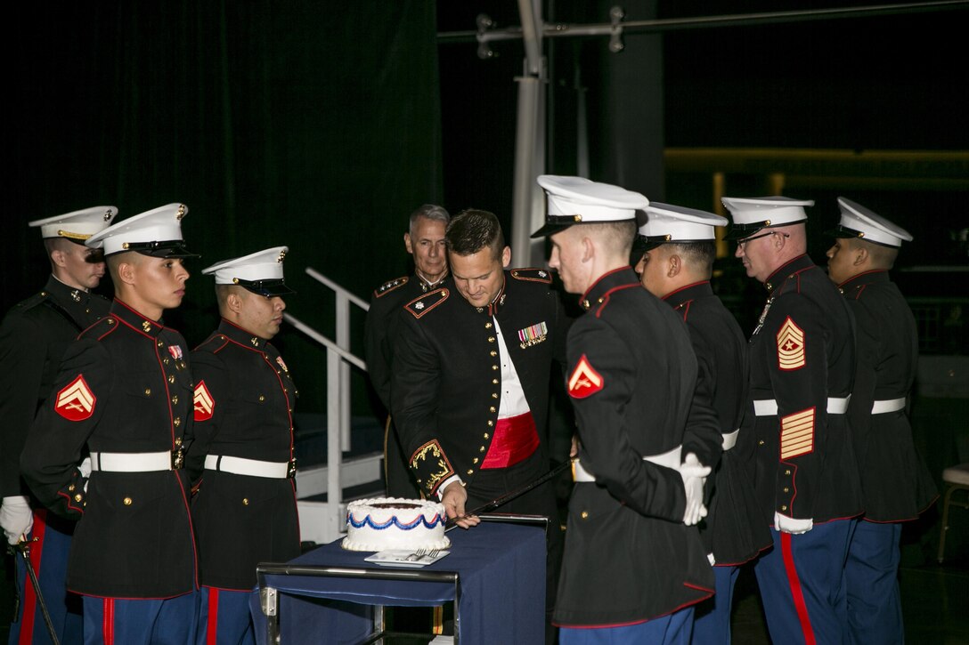 Lt. Col. Garth P. Massey (center), commanding officer of 2nd Battalion, 23rd Marine Regiment, 4th Marine Division, cuts the first slice of birthday cake during 2/23’s 241st Marine Corps Birthday Ball held Nov. 12, 2016, at the Ronald Reagan Presidential Library and Museum in Simi Valley, Calif. The Marine Corps Ball has been a Marine Corps tradition since 1951 and includes a sword detail, the reading of the Commandant Gen. Robert B. Neller’s birthday message and an official cake cutting for the oldest and youngest Marines present as well as the guest of honor who receives the first piece before giving a speech to those present. 